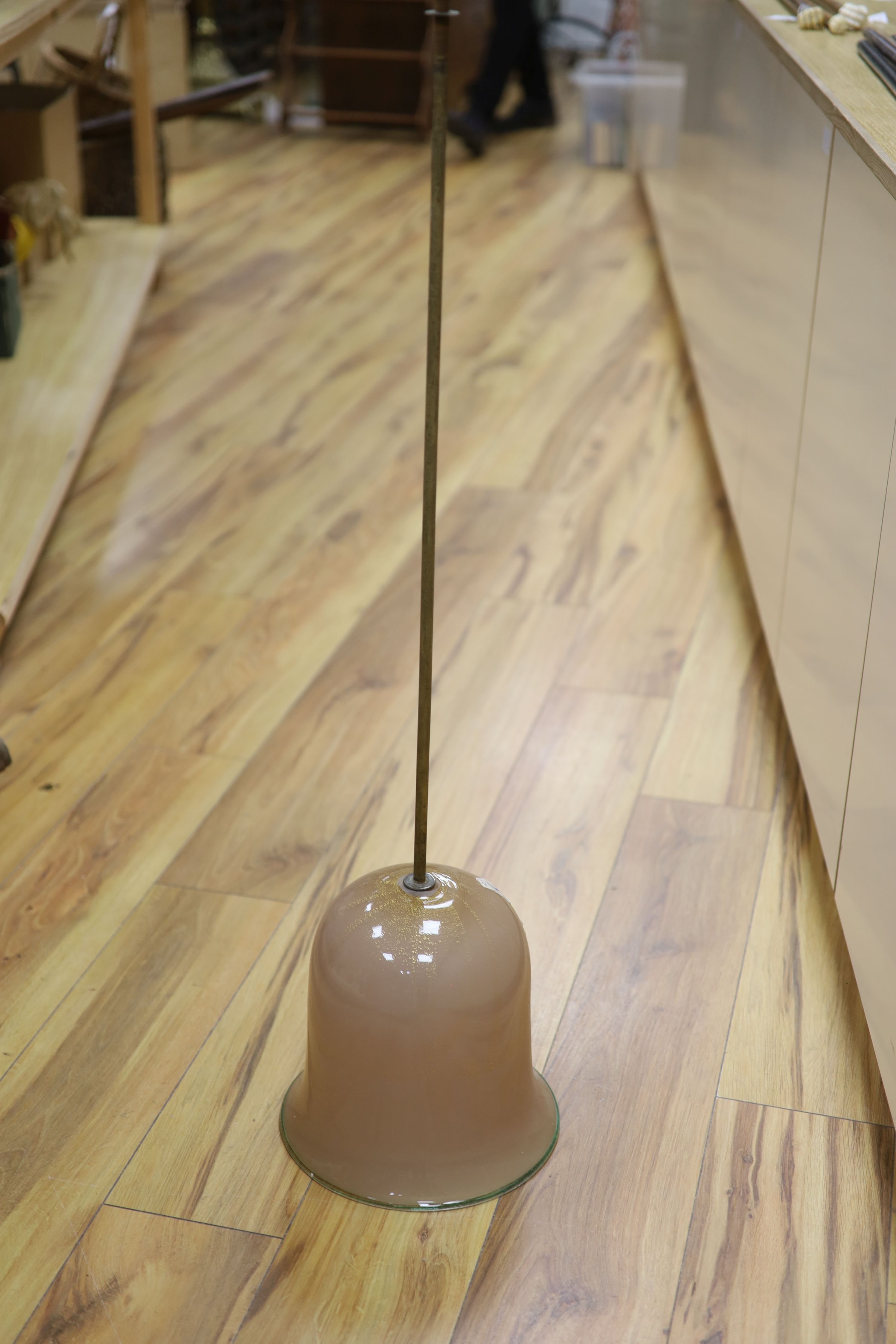 An Italian powdered gilt and pale brown glass ceiling pendant with green banding and a green glass six-branch chandelier (faults)